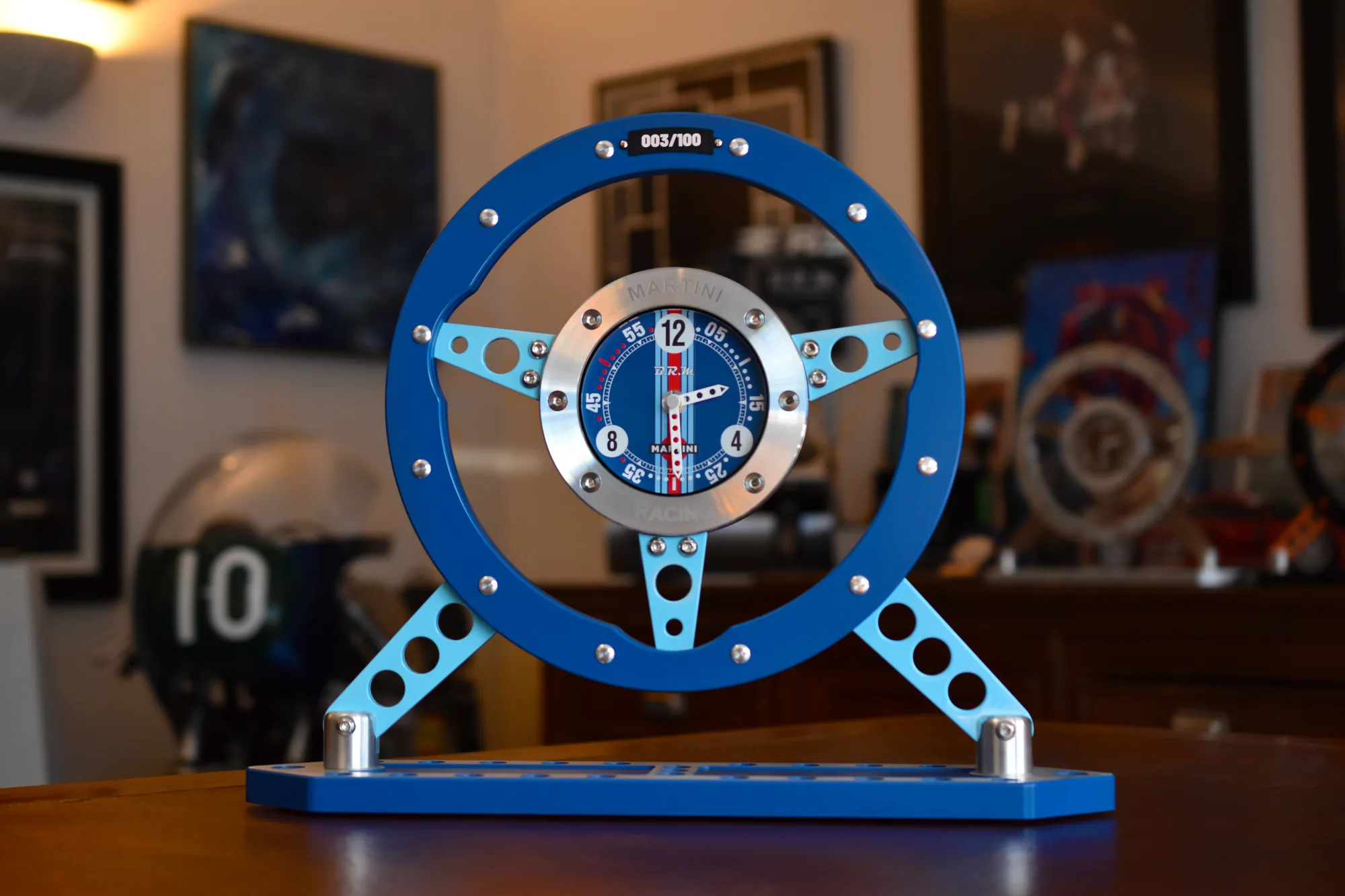 The Steering Wheel in Martini Racing livery, on a desk